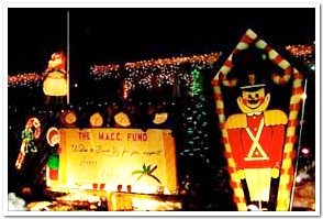 The MACC Fund sign and decorations at Candy Cane Lane